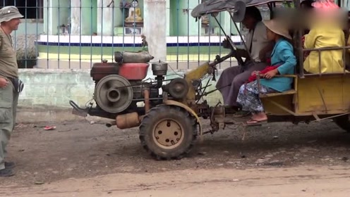 缅甸大街上改装了方向盘的手扶拖拉机