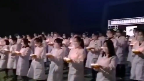 黄冈市民悼念援鄂护师张静静 医护人员手捧蜡烛低头默哀