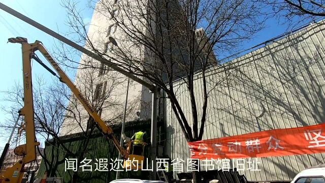 太原解放南路改造拆迁启动,路口监控探头围挡率先撤岗,清障车拖移路边车辆