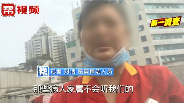 “家属不听我们的”医院楼道成“吸烟区”,一旁就贴着禁烟标语