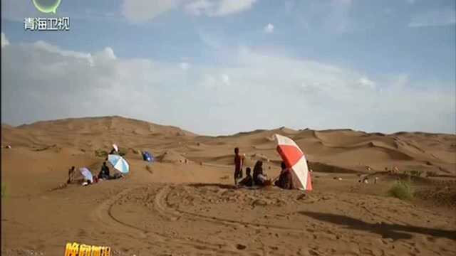 新疆:炎炎夏日 “火洲”沙疗热