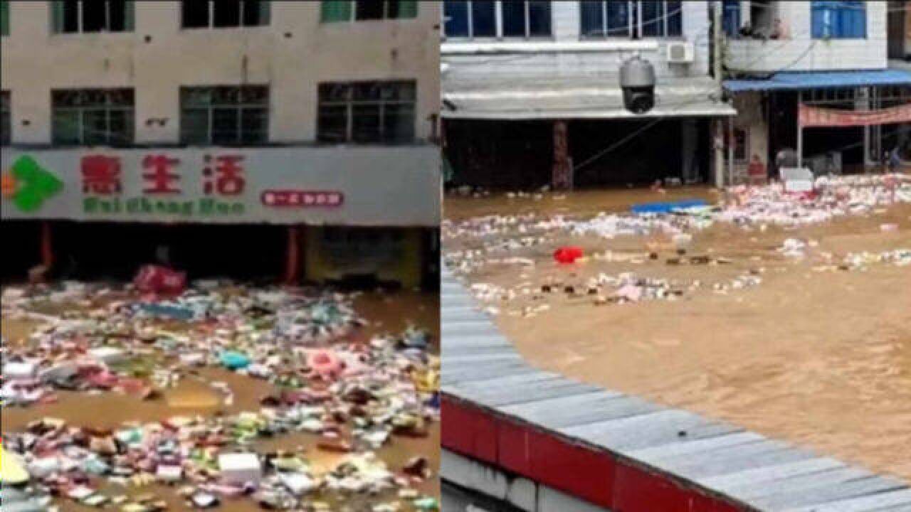 洪水过境道路成河多地被淹,超市门窗被冲垮,商品被水冲走