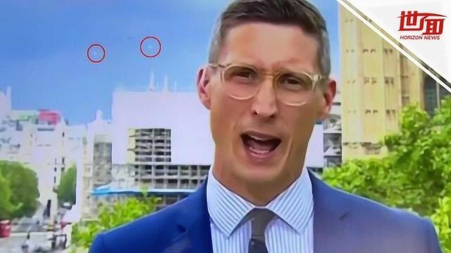 BBC直播UFO入镜?白色不明球体在议会大厦上空盘旋 观众紧急拍下画面