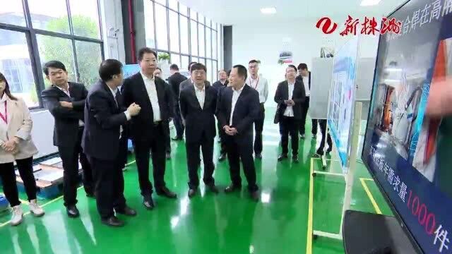 毛腾飞调研轨道交通产业发展