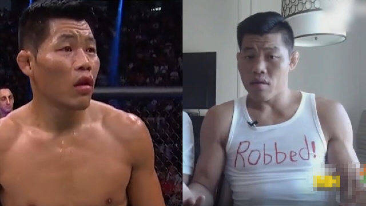 李景亮穿“被抢劫”背心回应被判输:101个不公平,UFC总裁也替他喊冤