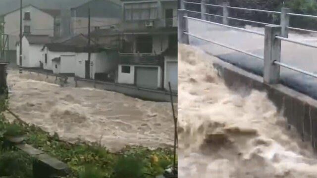 直击台风梅花致浙江嵊州暴雨 河道暴涨水漫上岸 现场被村民拍下