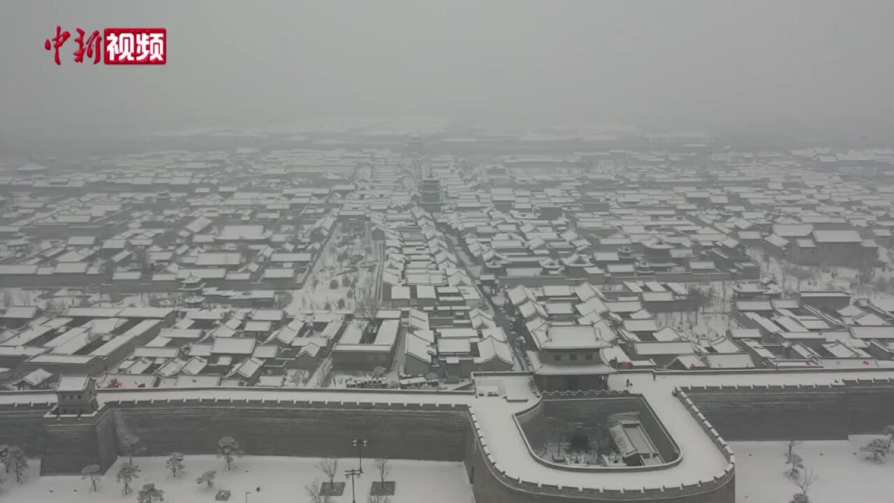 雪后太原古县城如“白凤凰”翱翔九天