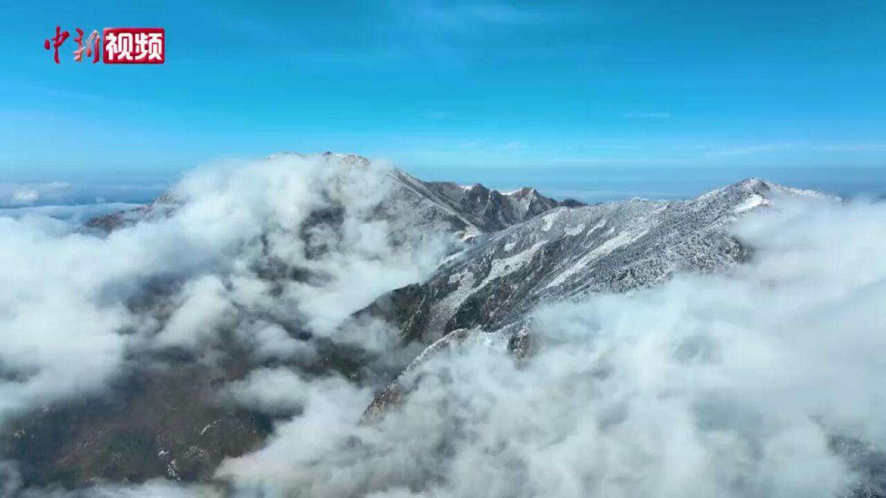 云海雪山相辉映绘制秦岭雪景图