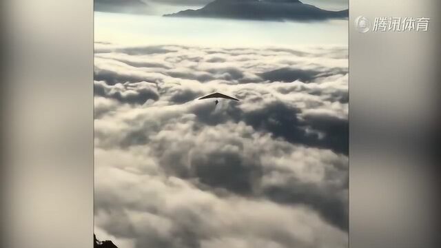 驾驶滑翔伞飞越群山 在云上飞翔感觉太美妙了