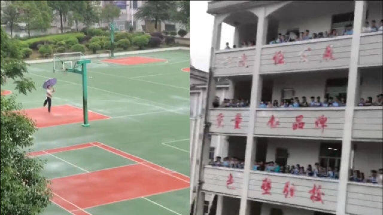 男生雨中独自撑伞打篮球,教学楼集体同学围观欢呼:淋不湿对篮球的热爱