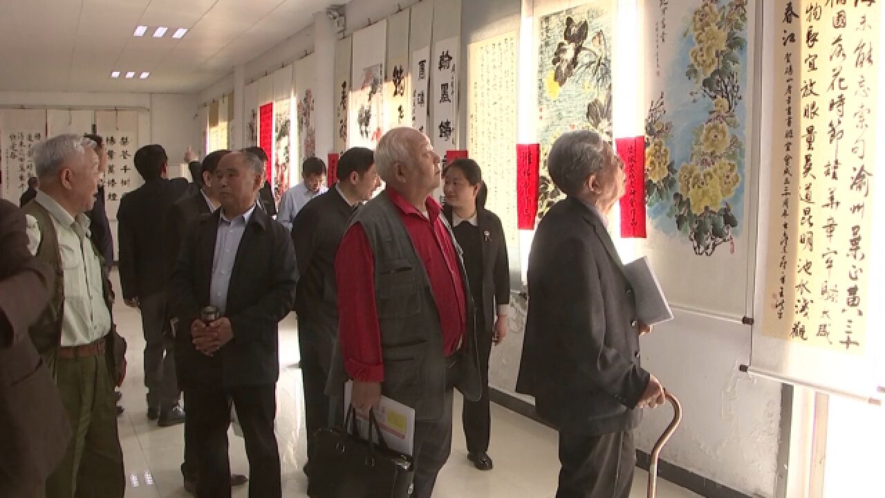 县老年书画摄影研究会成立20周年暨大型书画摄影展开幕式举行