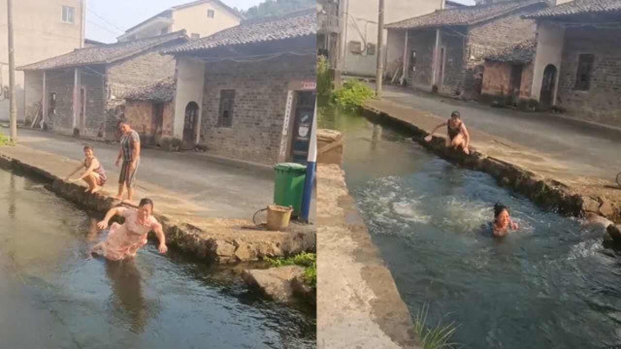 女子多年后回到村庄,惊喜发现小河依然清澈,一时兴起再次畅游