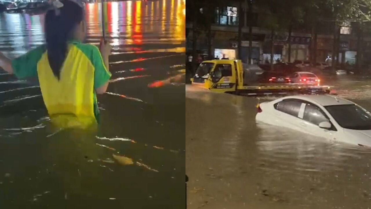 广州突降暴雨:番禺水浸齐腰淹没车辆 红色预警发布市民地铁口避雨