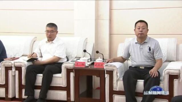 丁小强与省委台办主任李建红座谈