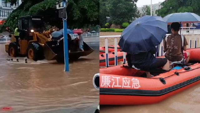 广东廉江暴雨城区积水严重 民警用划艇、铲车等护送考生赴考