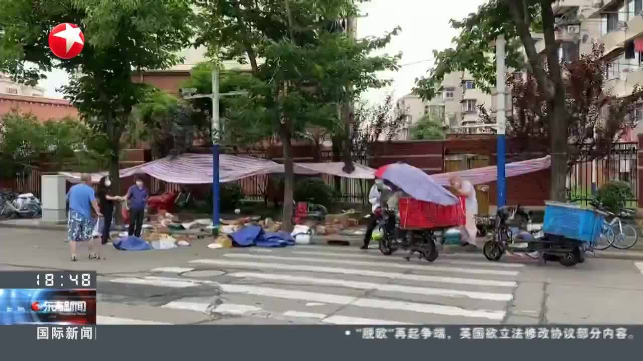 记者观察:疫情防控常态化之下快递如何有序进小区?