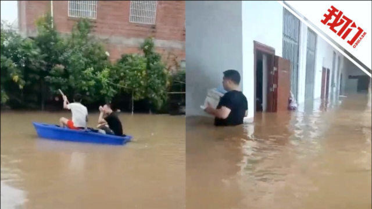 广西贵港遭遇强降雨 实拍居民用塑料盆和轮胎自制小船出行