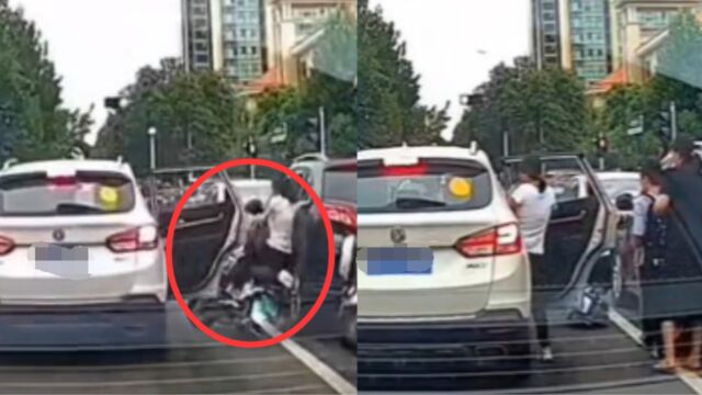 女子骑车遭遇“开门杀”,当街暴踹车门发泄,接下来的举动让人傻眼