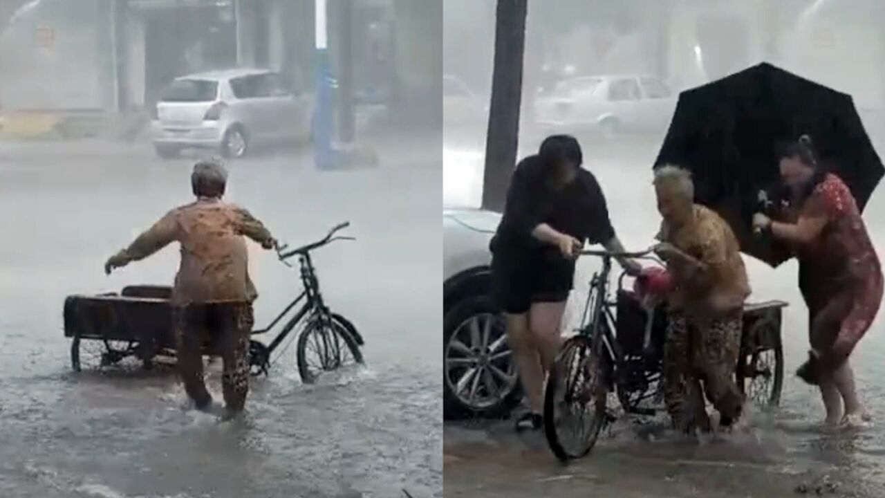 78岁老奶奶暴雨中追三轮车摔倒 幸遇好心店主冒雨搀她躲雨