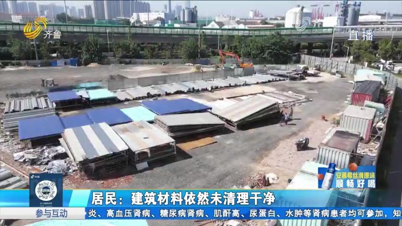 青岛一小区住宅楼前建钢材市场,严重扰民,开放商却迟迟未清理