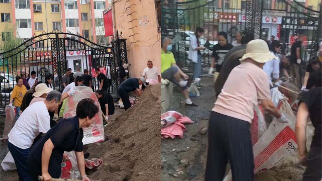 黑龙江一小区为预防台风卡努,业主未雨绸缪自发装沙袋建坝防水