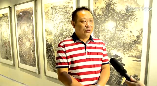 北京红森尚艺画院院长王信聪接受媒体的采访
