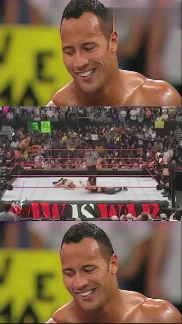 wwe巨石强森抄起板凳就打看王一般的男人摔倒开心的笑了