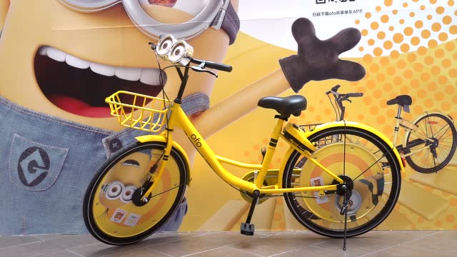 萌翻了!小黄人定制版共享单车亮相杭州