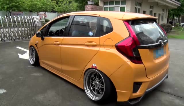 花10多万改装橙色"网红"飞度车,被举报1小时后就栽了!