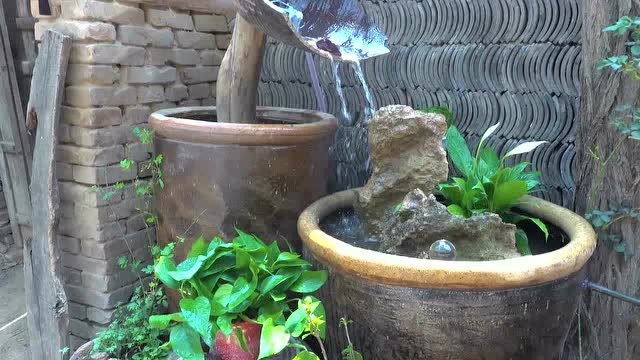 小伙用水缸和石头做了个流水鱼池,十几年的老院子瞬间变了模样