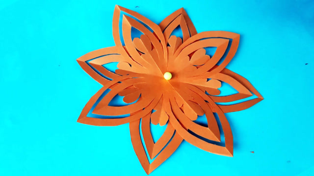 手工剪纸折纸教程教你制作一个漂亮的镂空纸花