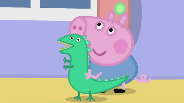 抱着恐龙先生的乔治,抬着头看着前面,大眼睛忽闪忽闪的可爱极了