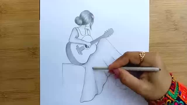铅笔素描画:画可爱弹吉他的女孩