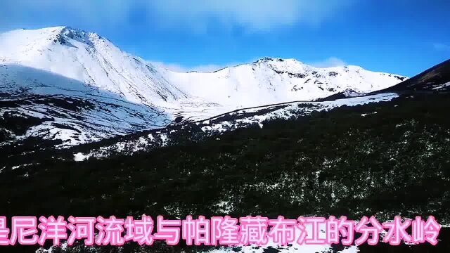 川藏线经过色季拉雪山,眺望雪山,一条银色天龙横亘天际,气势磅礴银光灿烂