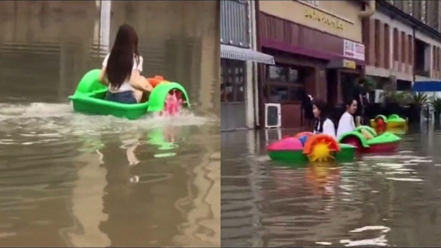 童心未泯!合肥暴雨过后成“威尼斯”,女子在大街坐玩具船玩耍!