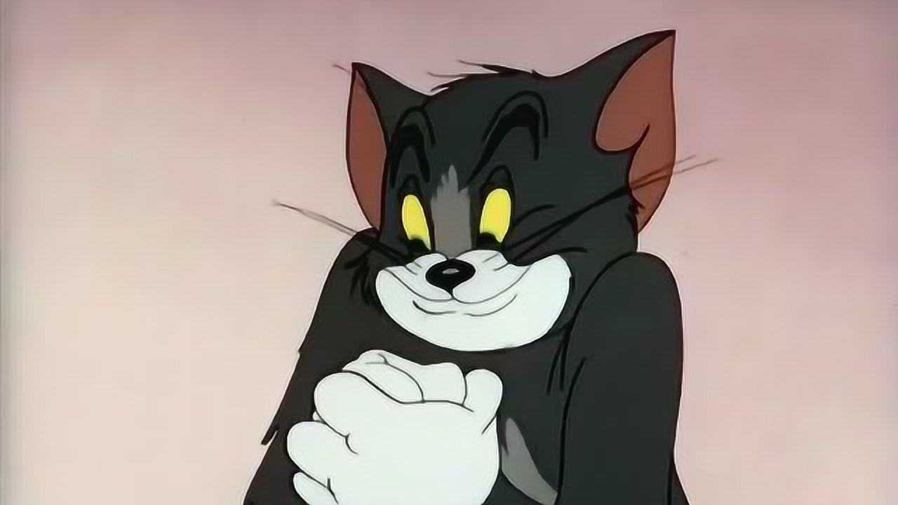 猫和老鼠汤姆一边看书一边大笑引得杰瑞非常好奇过来看