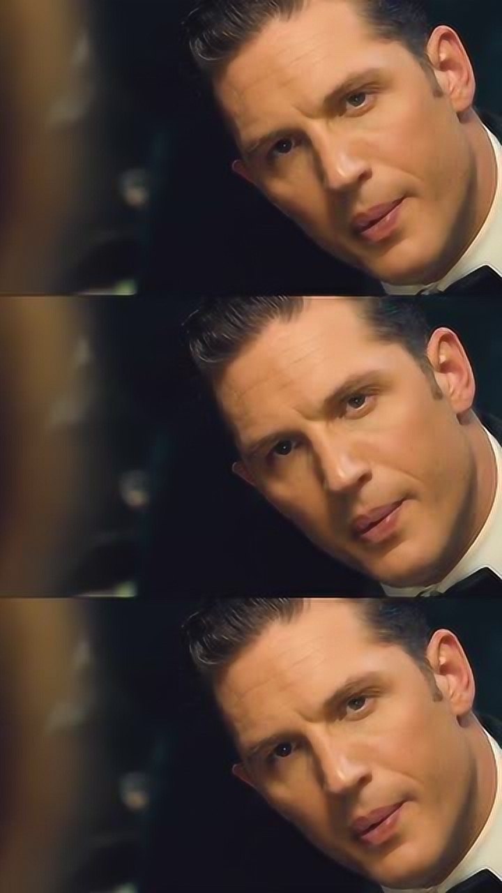 汤姆哈迪有些人表面穿着西装实际上他还有个能穿上的宠物