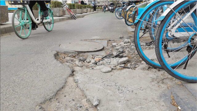 含光路南段路面施工留下沟槽 频有骑车市民被“绊倒”