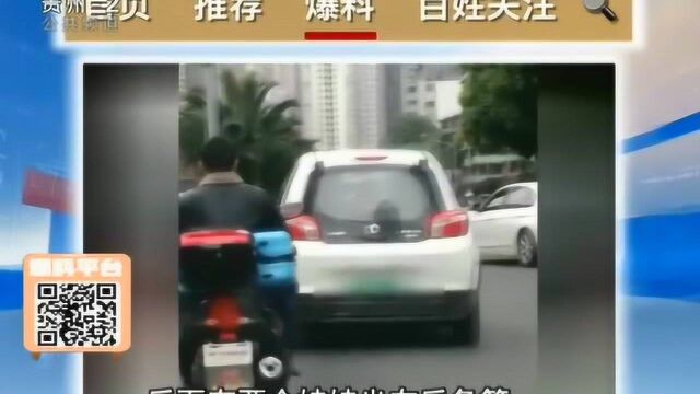 五人座的电动汽车里面竟然坐了八个人?还有两个孩子坐在后备箱!