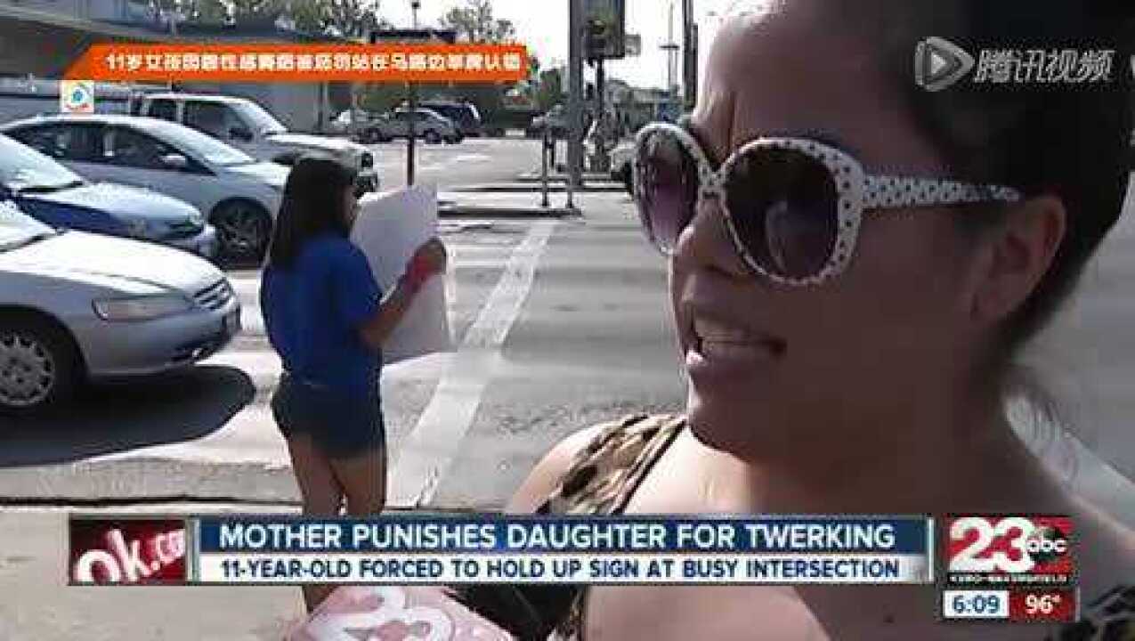 11岁女孩因跳性感舞蹈被罚站马路举牌认错_高清