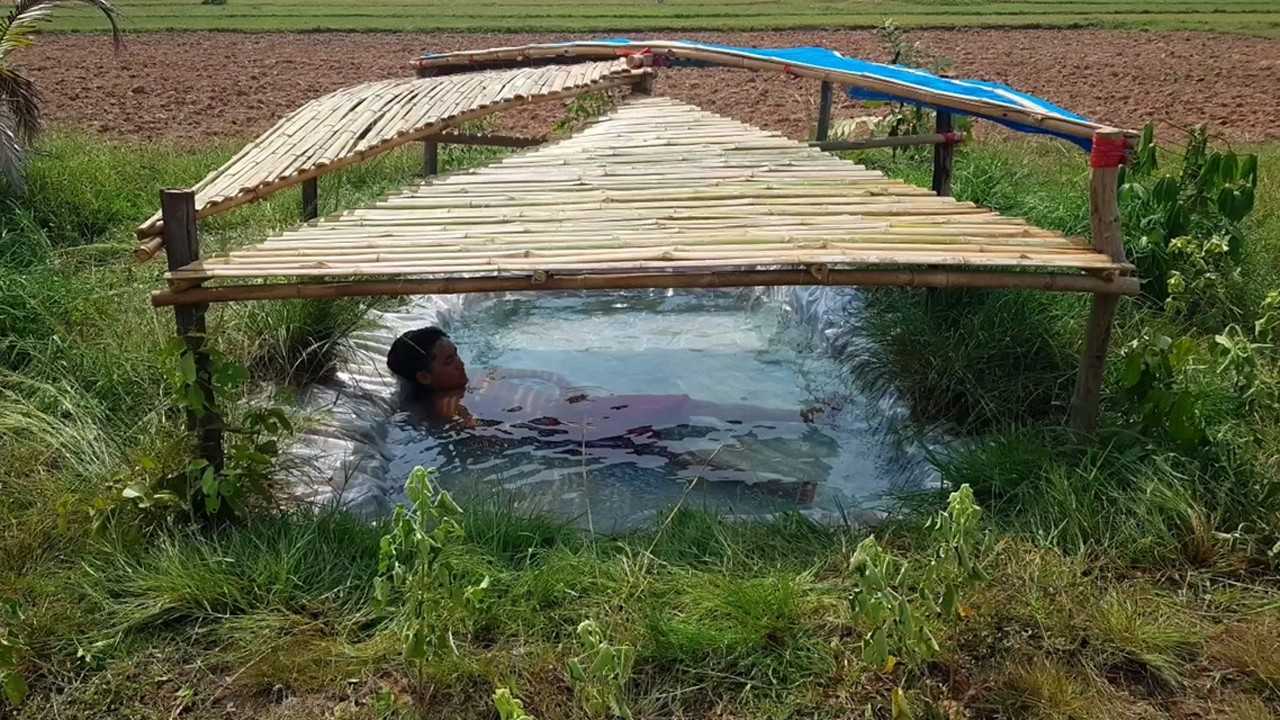农村小伙野外自建游泳池清凉整个夏天网友最健康的避暑方法