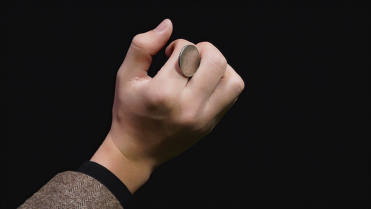 魔术揭秘:单手转硬币,看完后你也可以做到