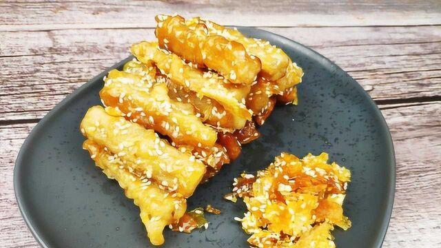 外表像玻璃的茄子,面子脆酥里子茄子香嫩,这道甜品叫玻璃茄子