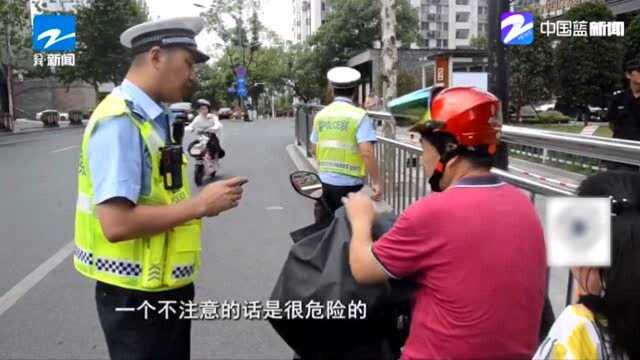 金华交警开启电动车闯红灯铁拳整治行动 不少驾驶员闯红灯被罚