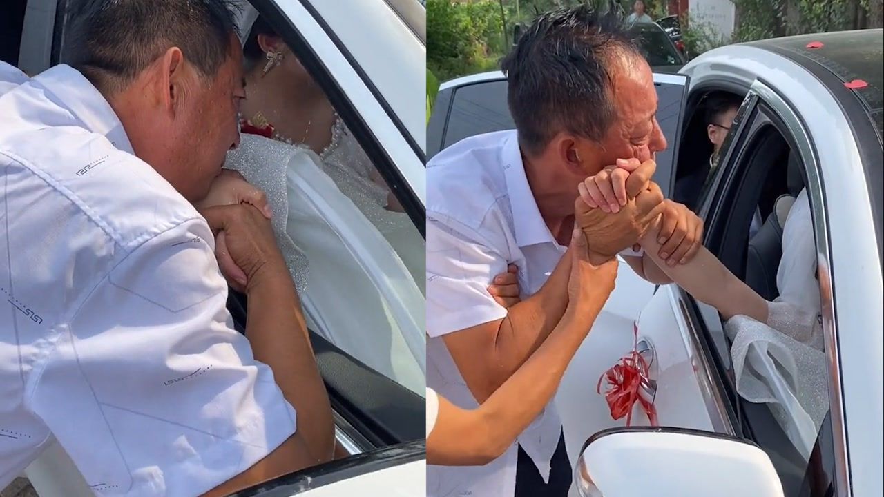 女儿出嫁父亲拉着女儿的手贴在脸庞不断摩挲场面令人泪目
