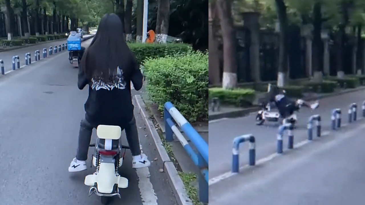 新手女生在小区里练习骑电瓶车,刚起步就拧紧油门瞬间开到路对面