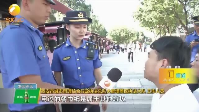 奶茶属于什么垃圾吗?西安垃圾开始分类,景区引导员现场宣传