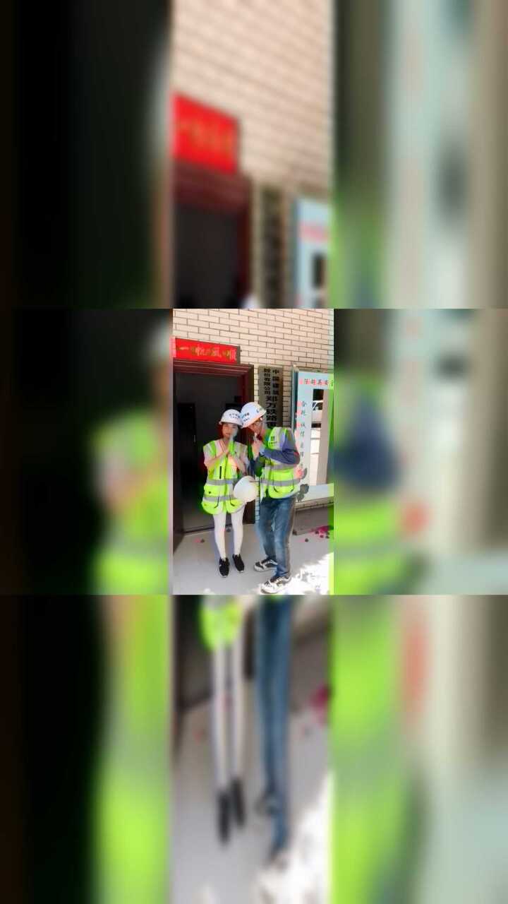 工地上为工人们佩戴安全帽_腾讯视频