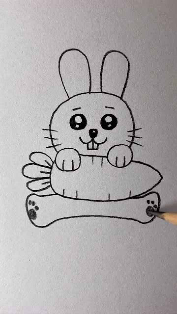 画抱着大萝卜的可爱小兔子