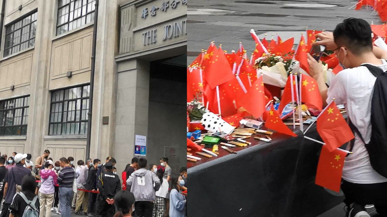 上海四行仓库遗址前插满国旗,各地游客纷纷涌来缅怀先烈